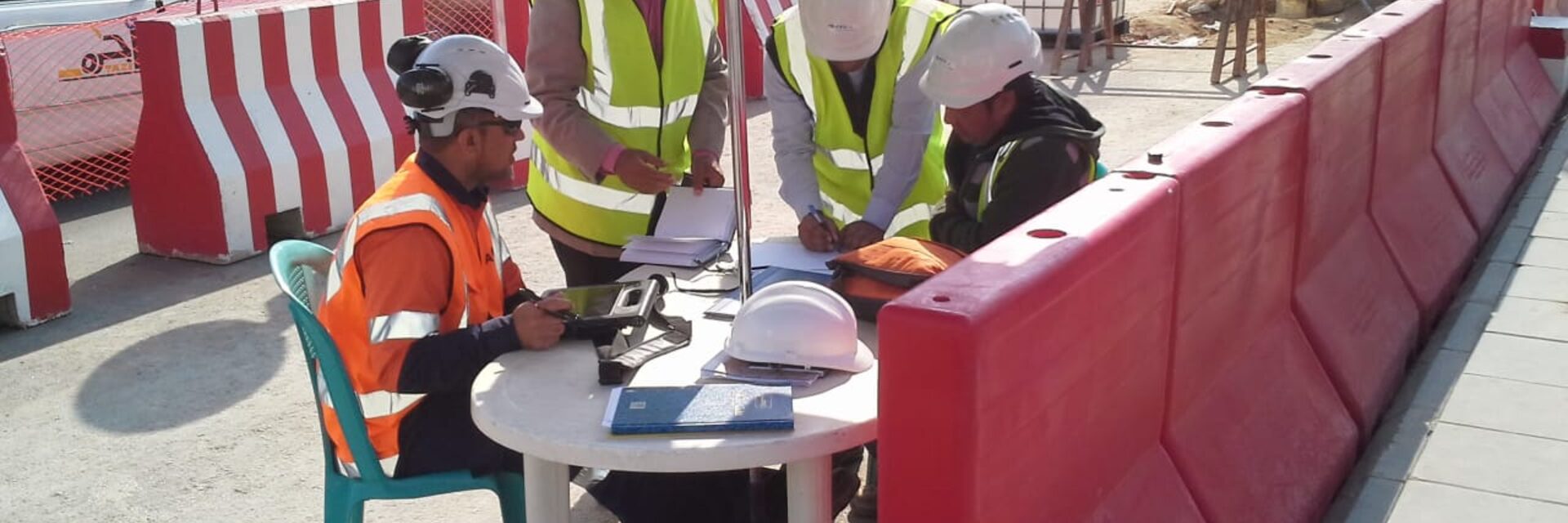 Saq Al-Ard site supervision team reviewing survey data on location